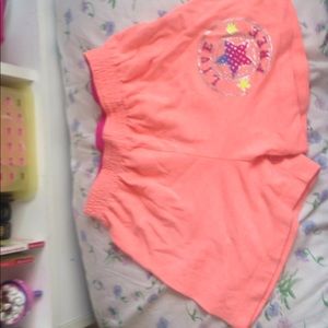 Peach shorts that say live free